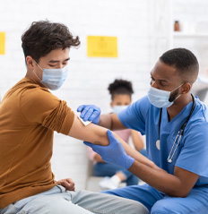 doctor-giving-covid-19-and-Influenza-vaccine